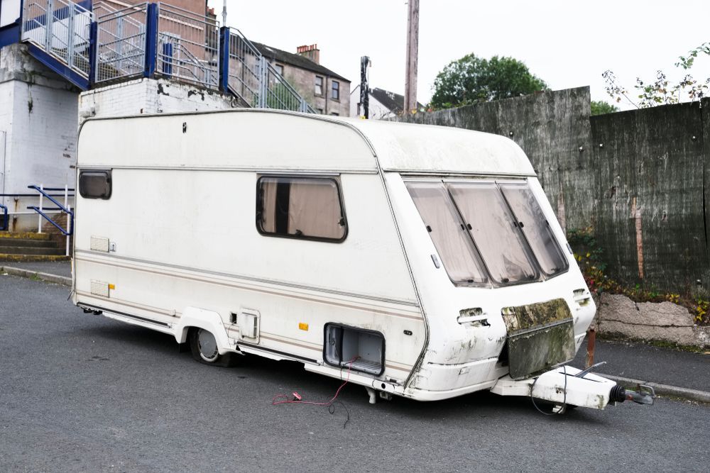 A White Caravan is Parked on the Side of the Road — Demco In Currumbin Waters, QLD