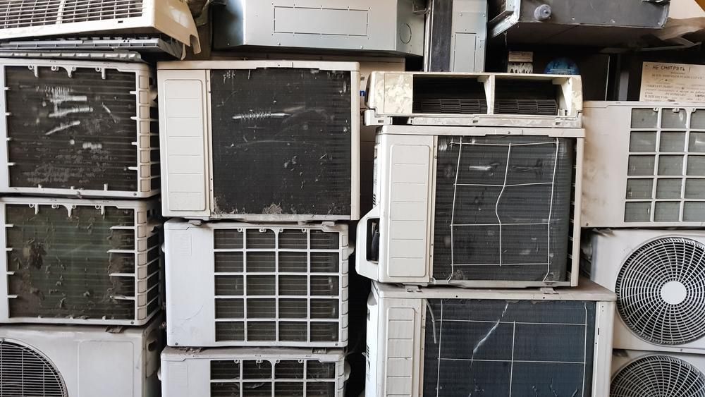 A Pile of Old Air Conditioners Stacked — Demco in Currumbin Waters, QLD