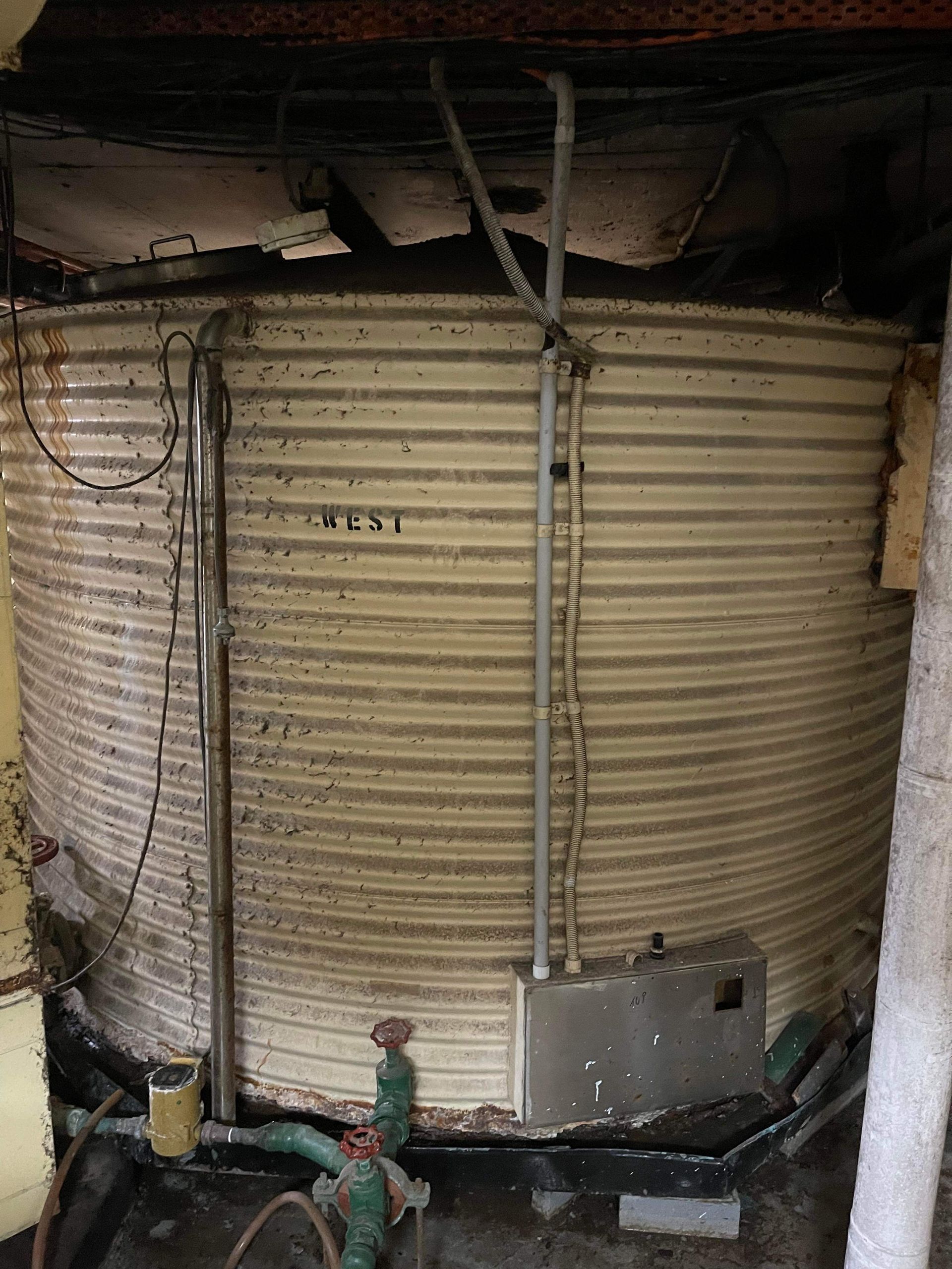 A Large Metal Tank with the Word Nest Written on It — Demco in Currumbin Waters, QLD