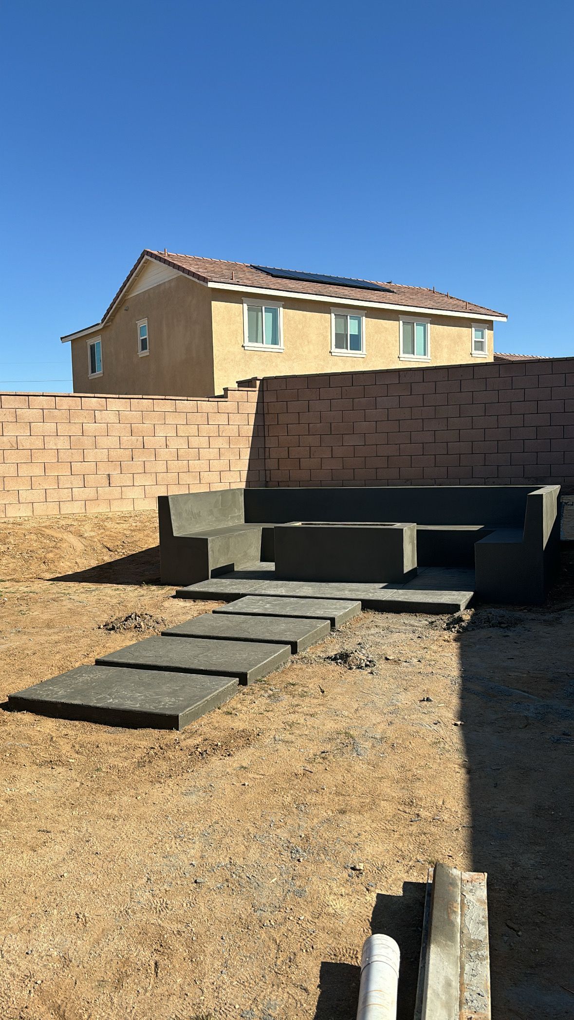 Concrete bench and stepping stones poured in Victorville California
