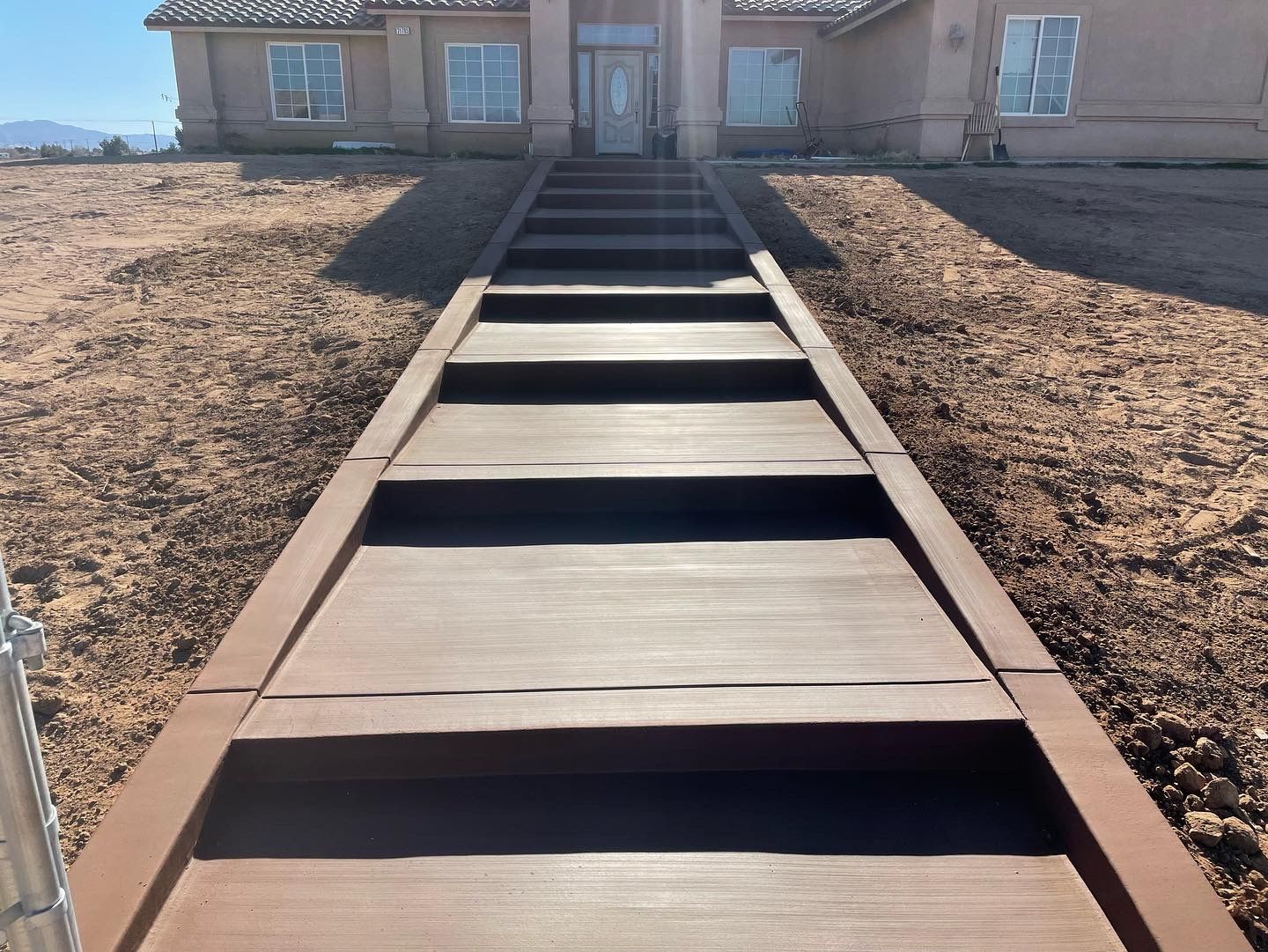 Colored broom finish steps formed, poured, and finished for residential property in Hesperia California