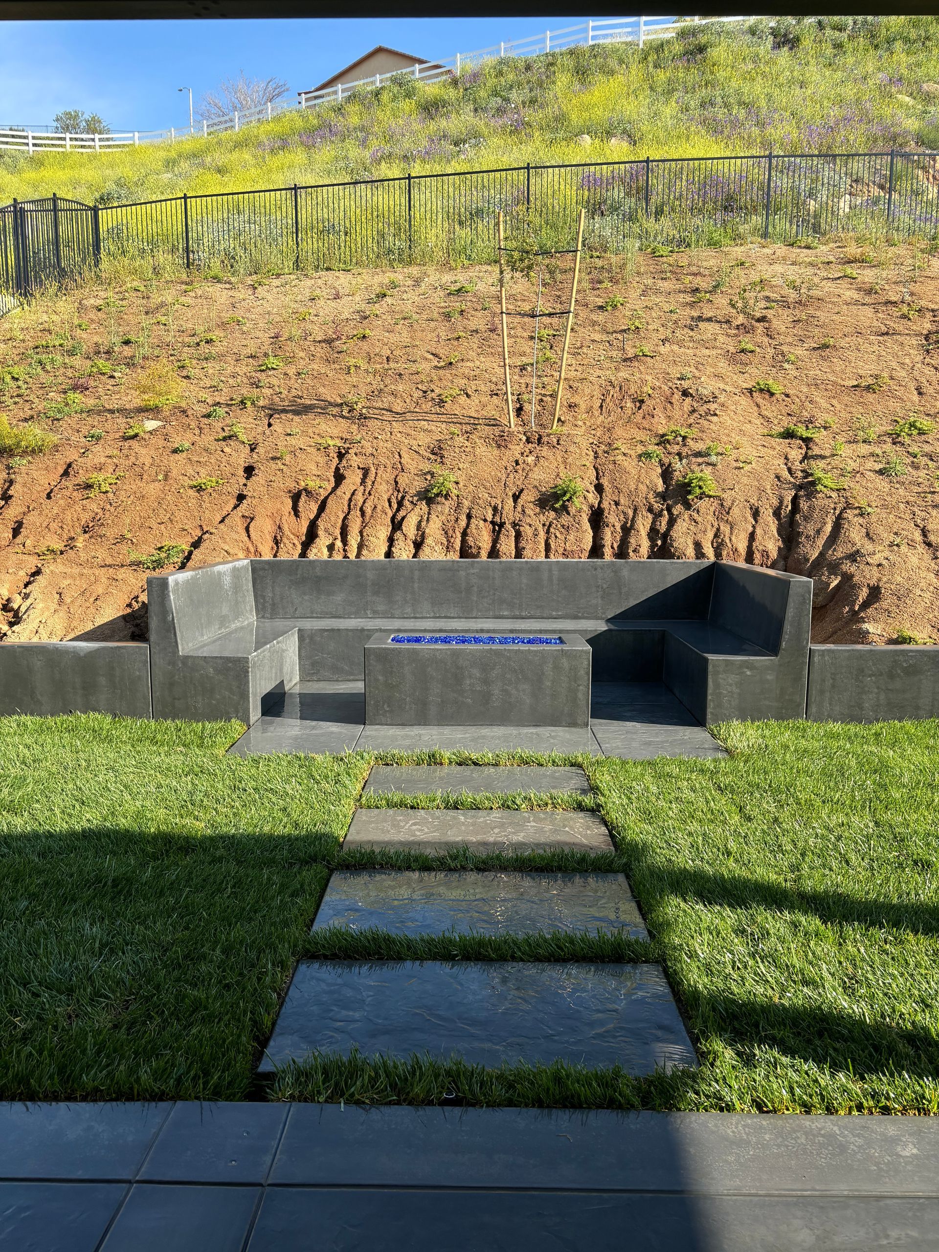 Finished backyard concrete patio for homeowner in San Bernardino County