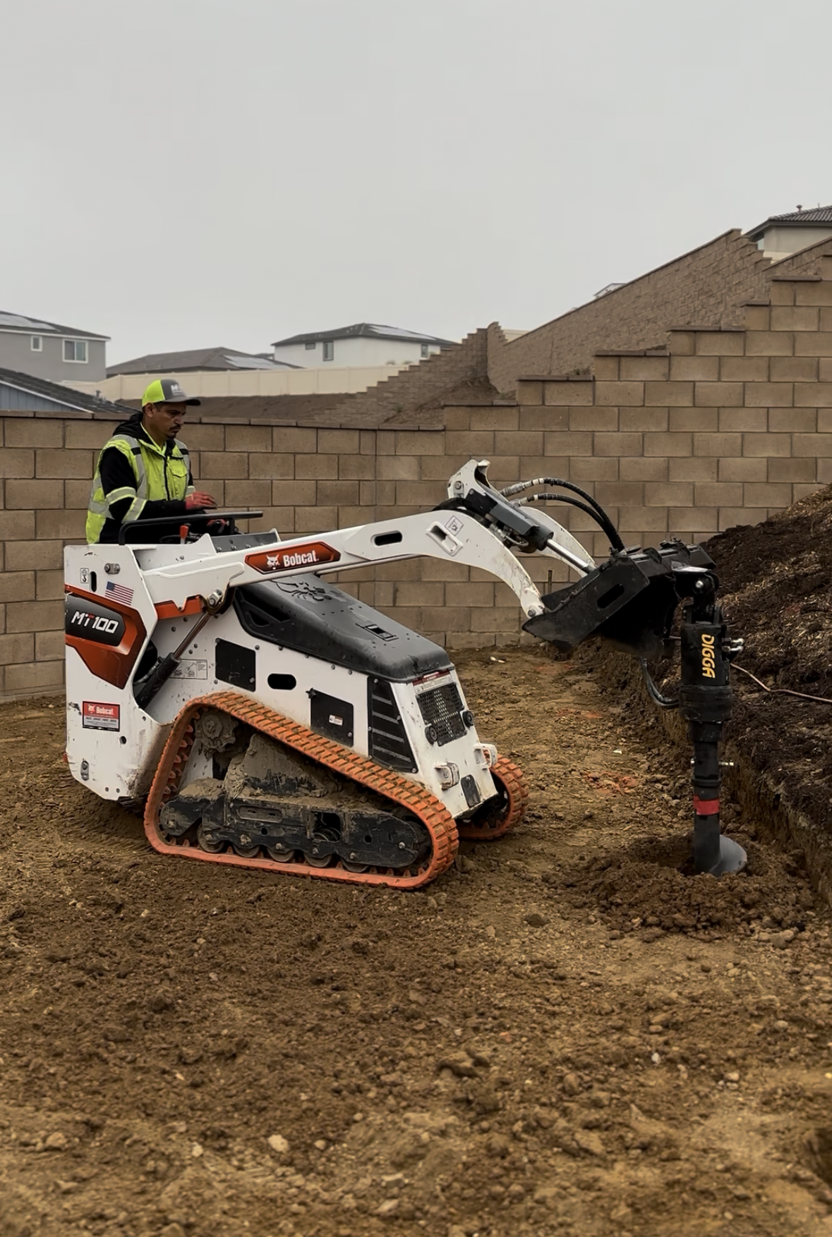 Augering holes for footings in Norco California