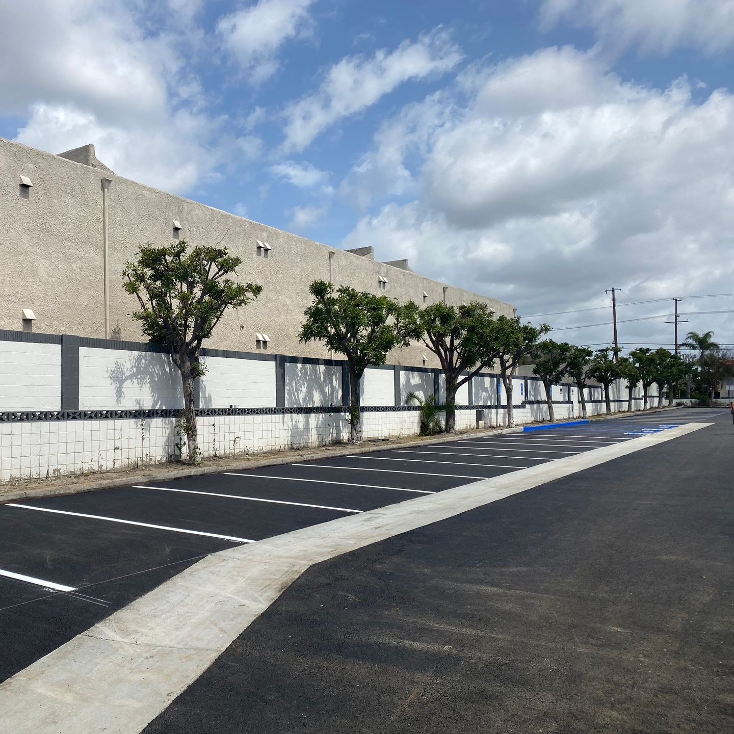 Asphalt parking lot demolition and replacement with concrete v-ditch in the Inland Empire