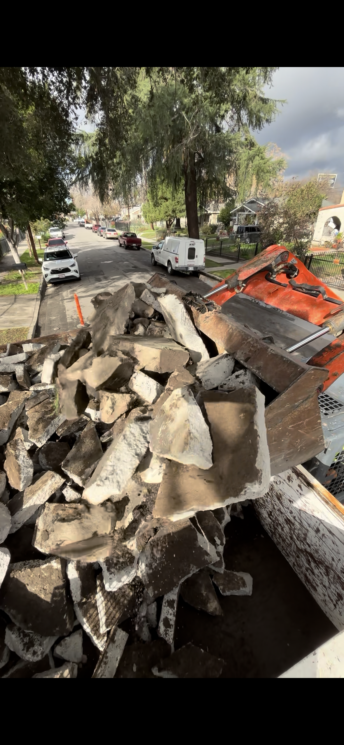 Loading broken concrete into super ten truck in Rancho Cucamonga California