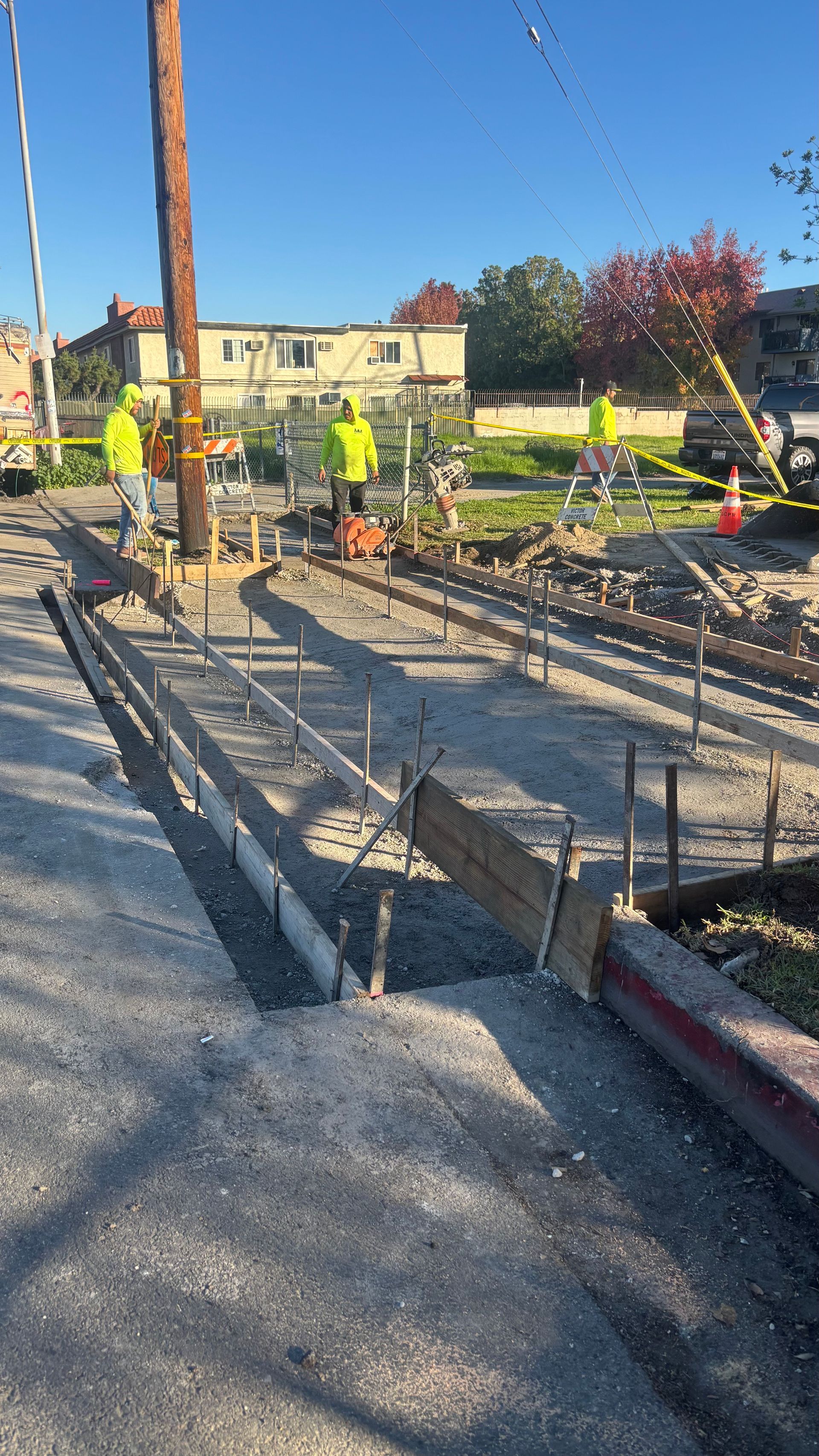 Concrete contractor installing new driveway approach and parking area in Ontario