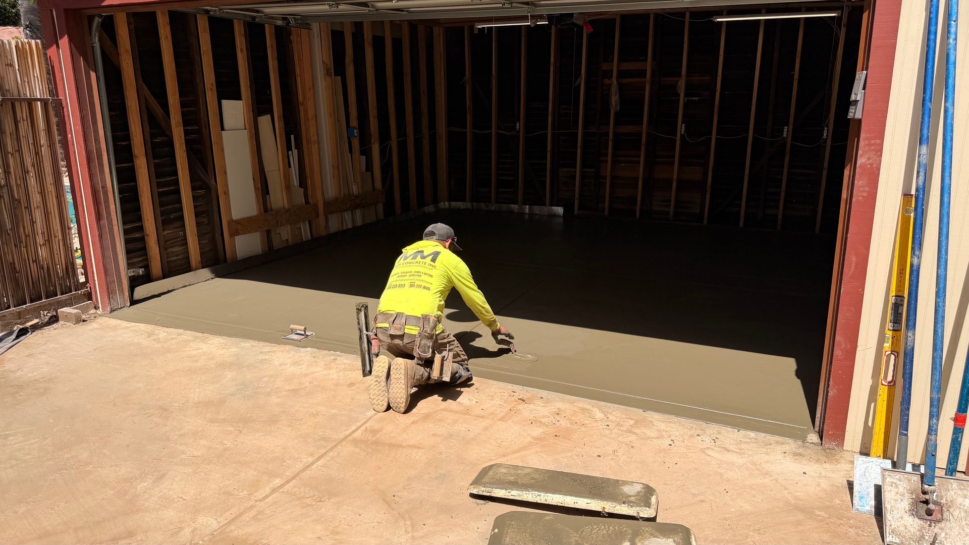 Garage concrete slab removal and repour with broom finish in Redlands California