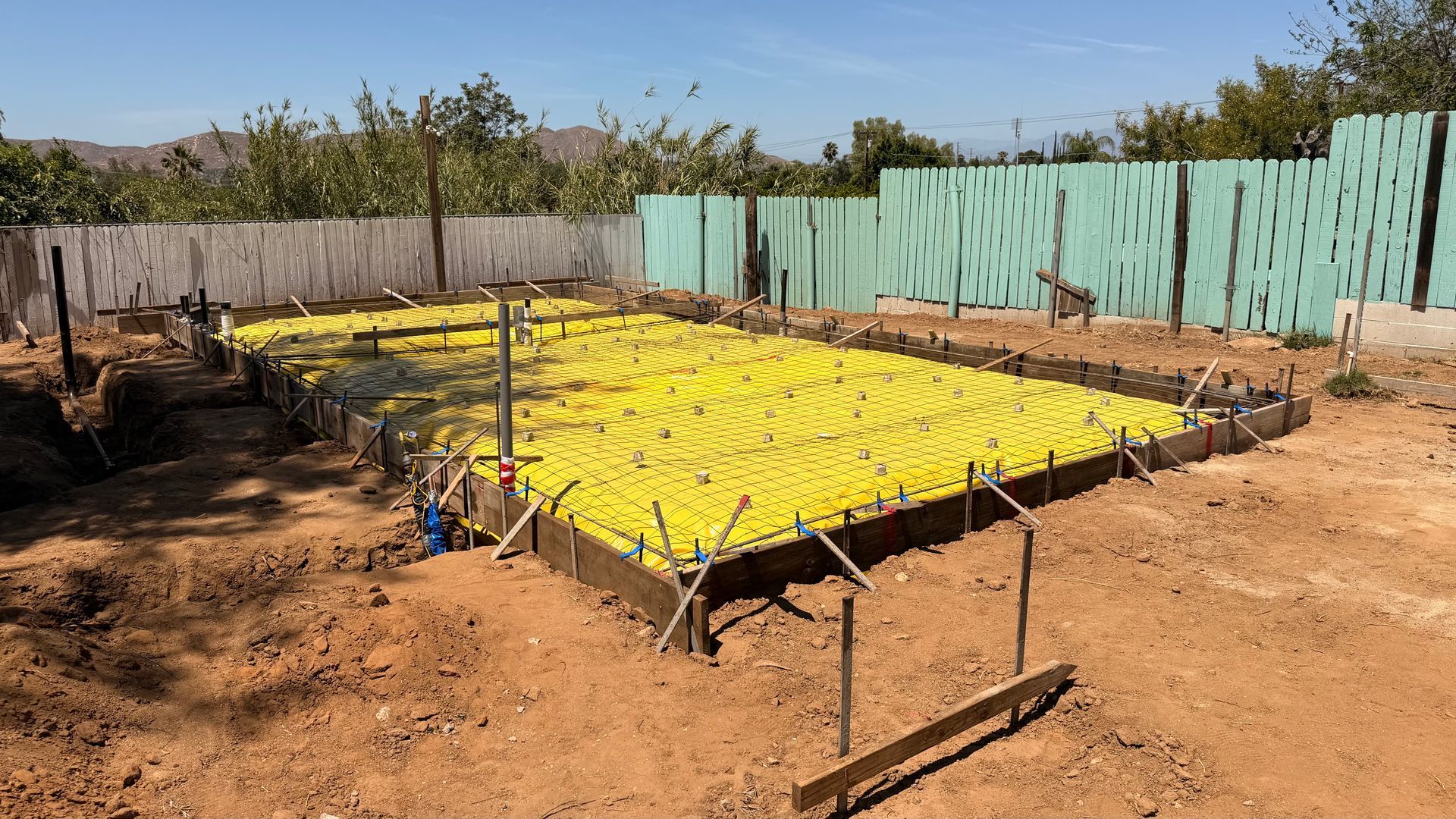 ADU foundation forms, vapor barrier, and rebar ready for concrete in Riverside California