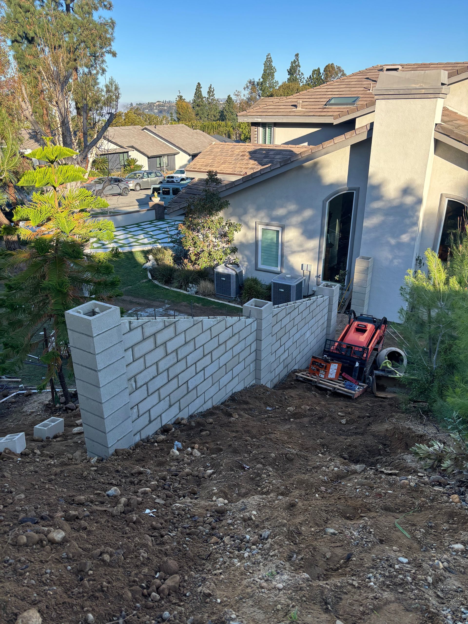 Block wall with columns built on steep hillside in Anaheim California