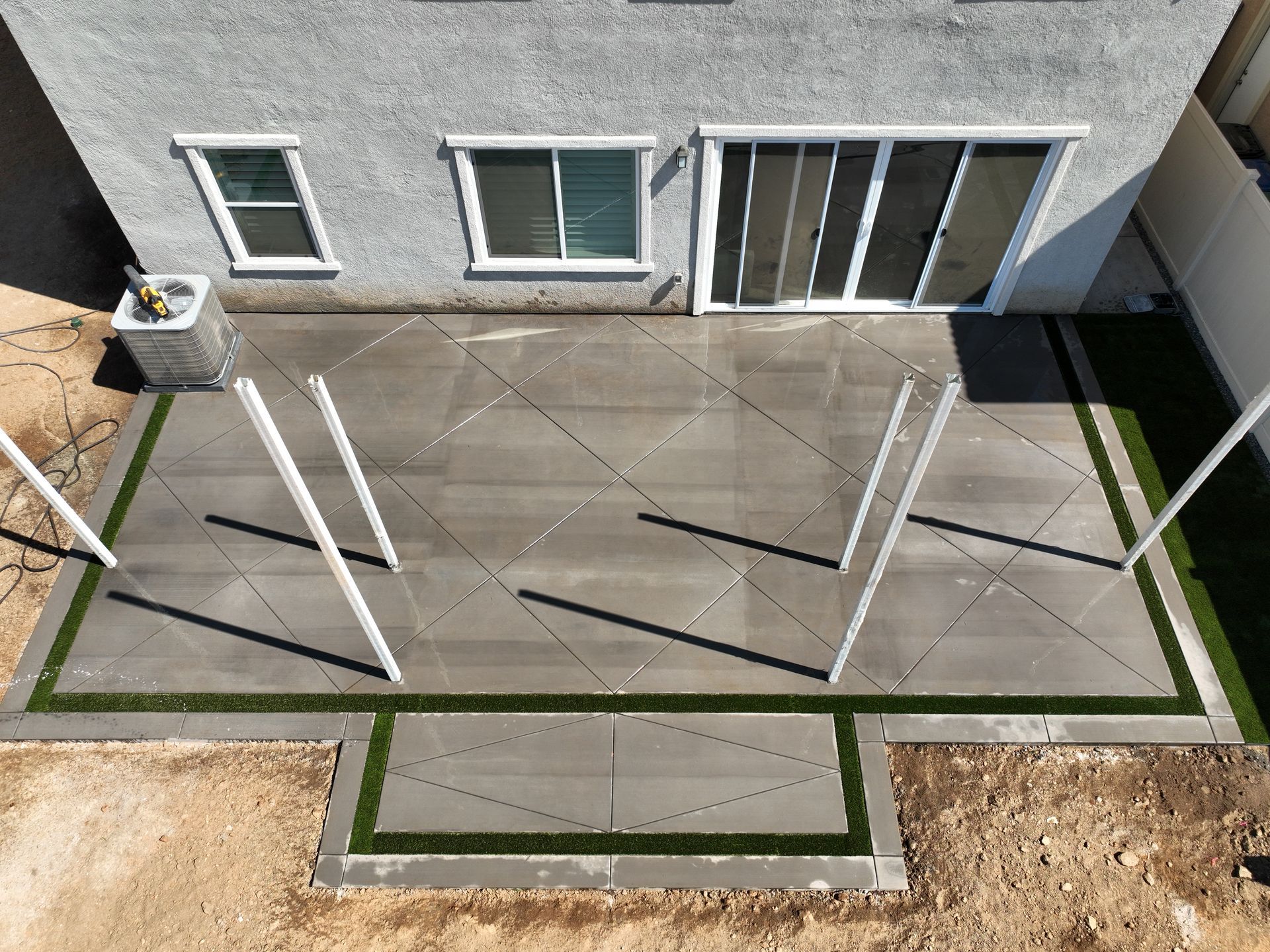 Backyard concrete patio poured and finished by MM Concrete