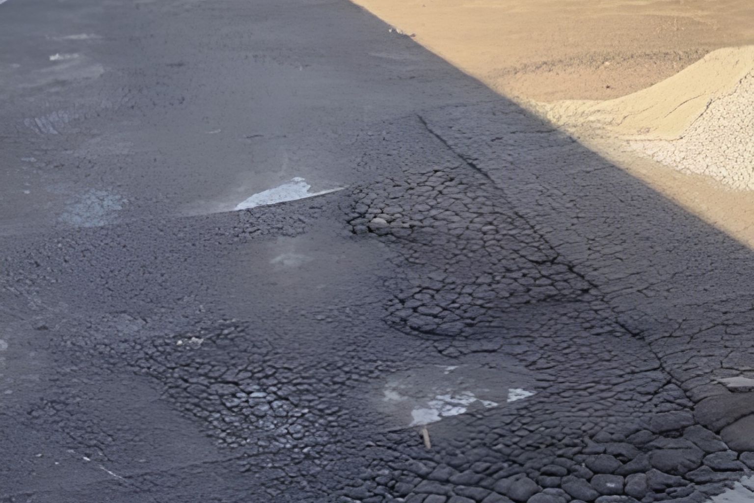 Aged commercial roof surface showing coating deterioration and blistering before restoration