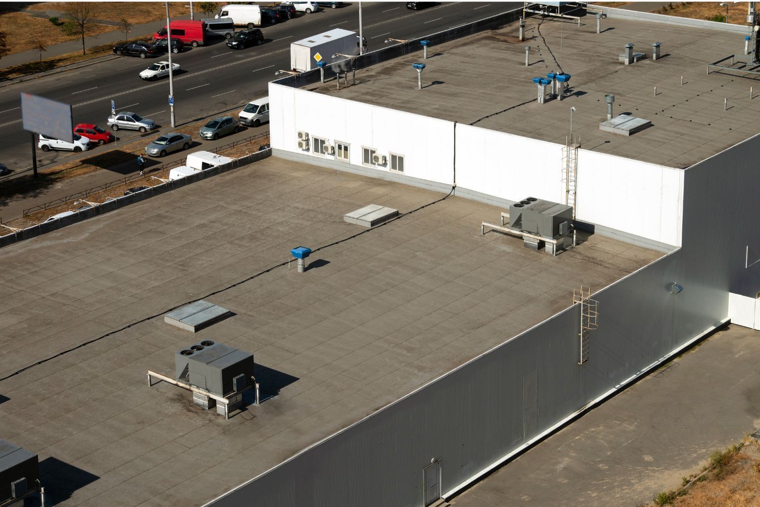 Aerial view of a commercial flat roof in Wisconsin maintained to extend its service life