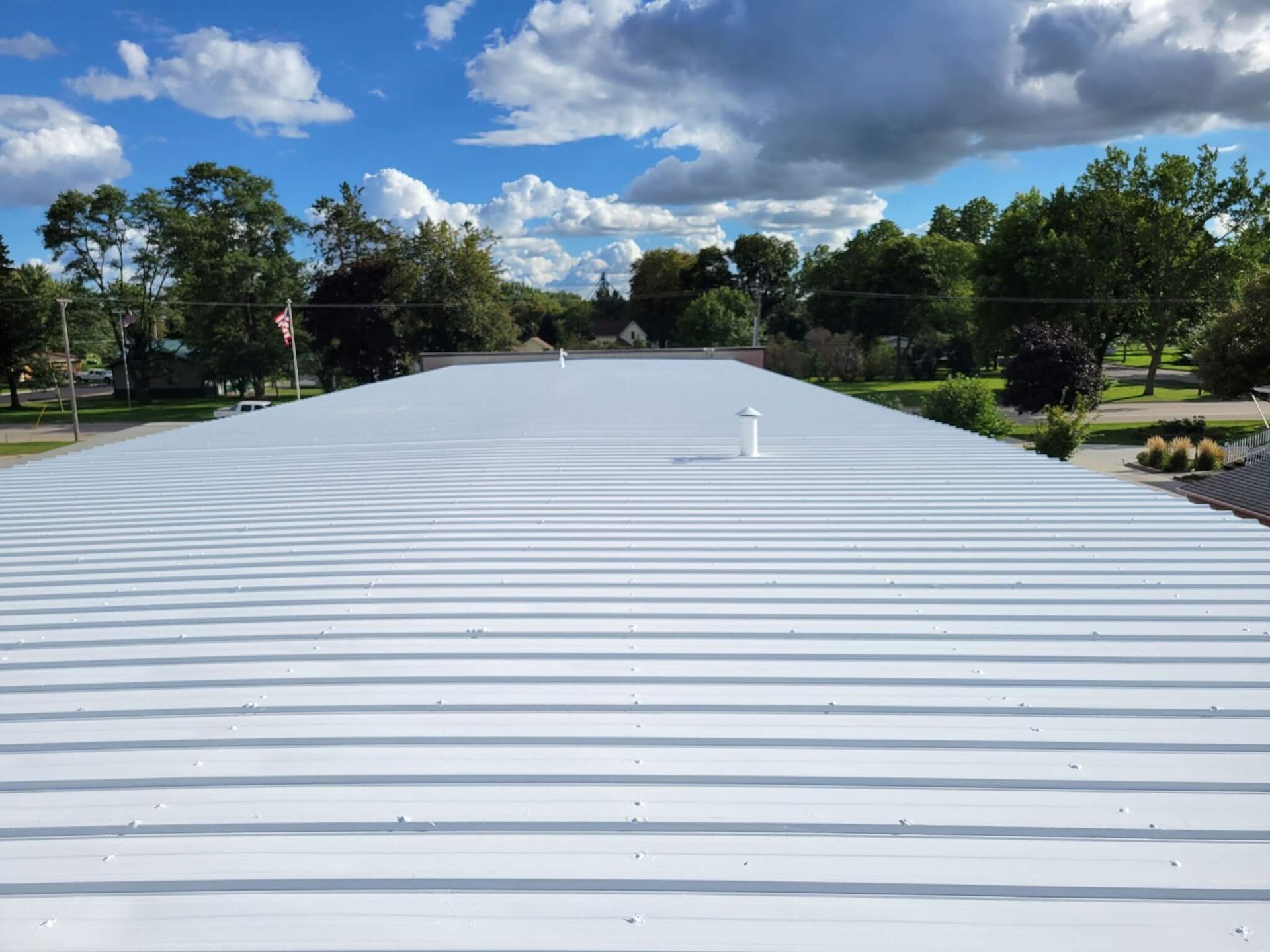 Close-up of white roof coating on a commercial flat roof in Hudson, WI