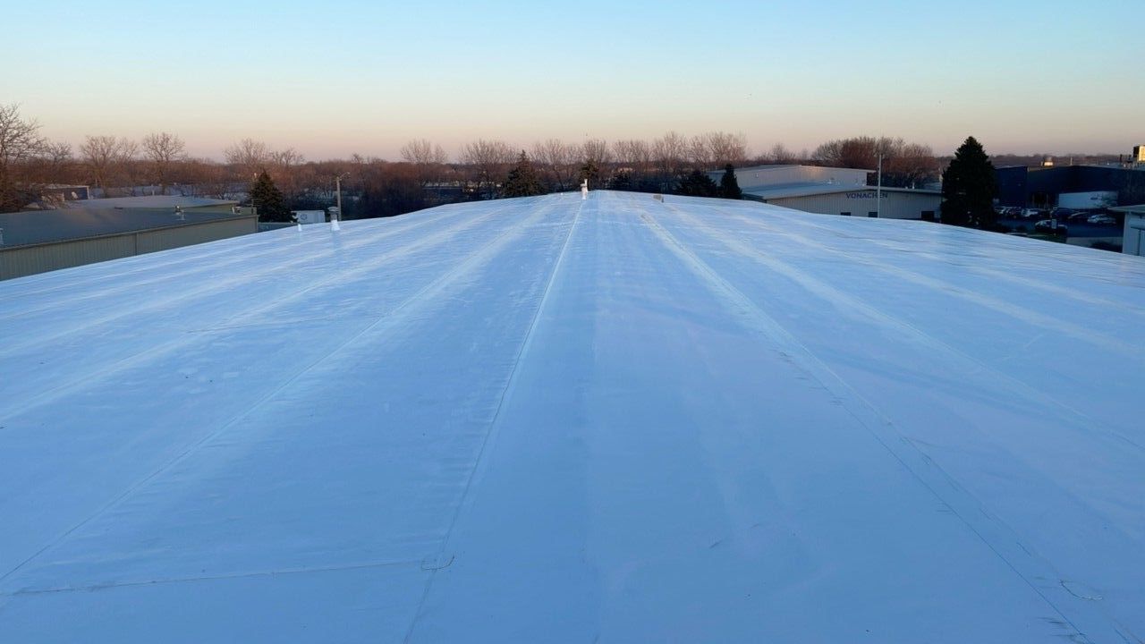 Snow-covered commercial flat roof in Hudson, WI
