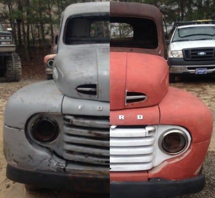 Split vintage Ford truck front, half gray and half red, parked outdoors