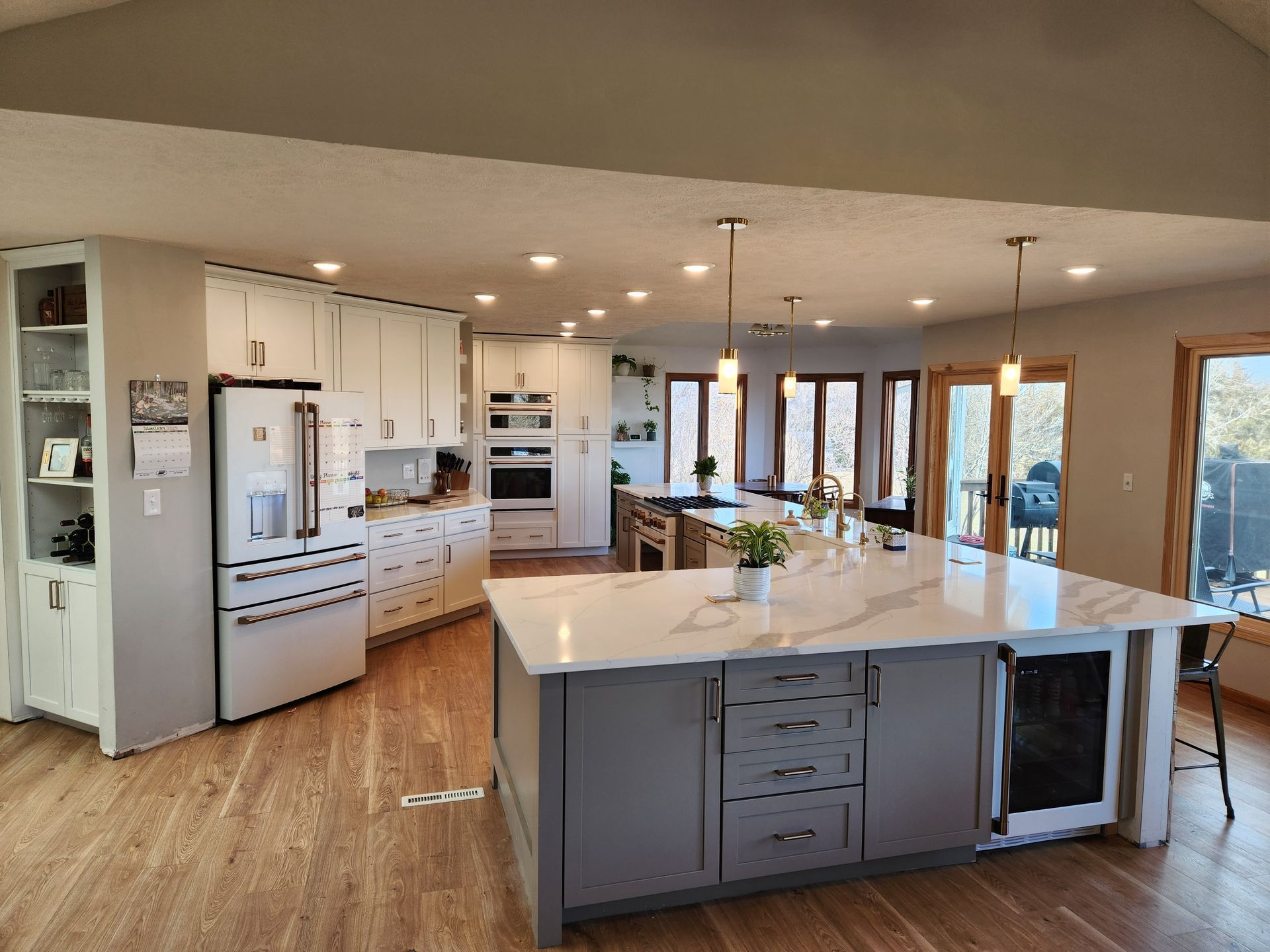 There is a large island in the middle of the kitchen.