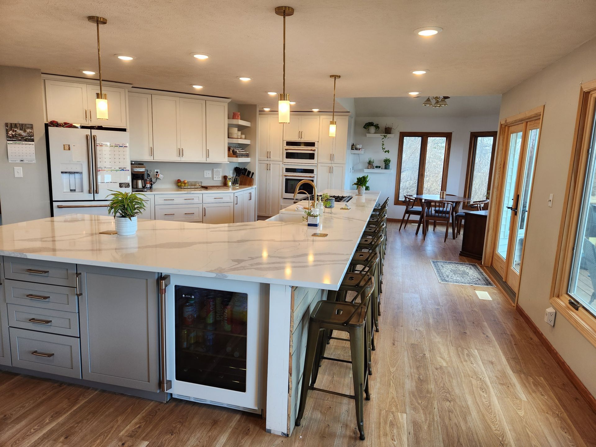 A kitchen with a large island in the middle of the room.