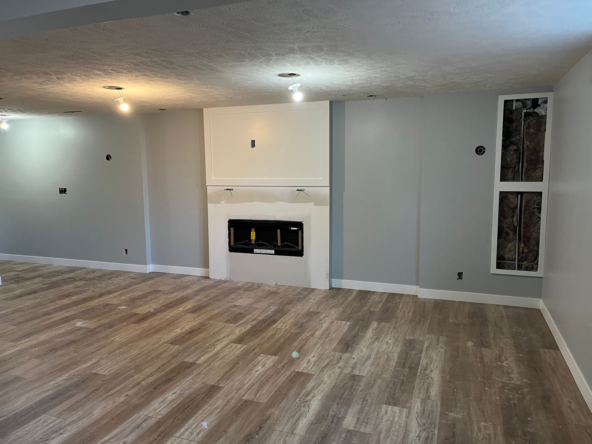 There is a fireplace in the middle of the room.