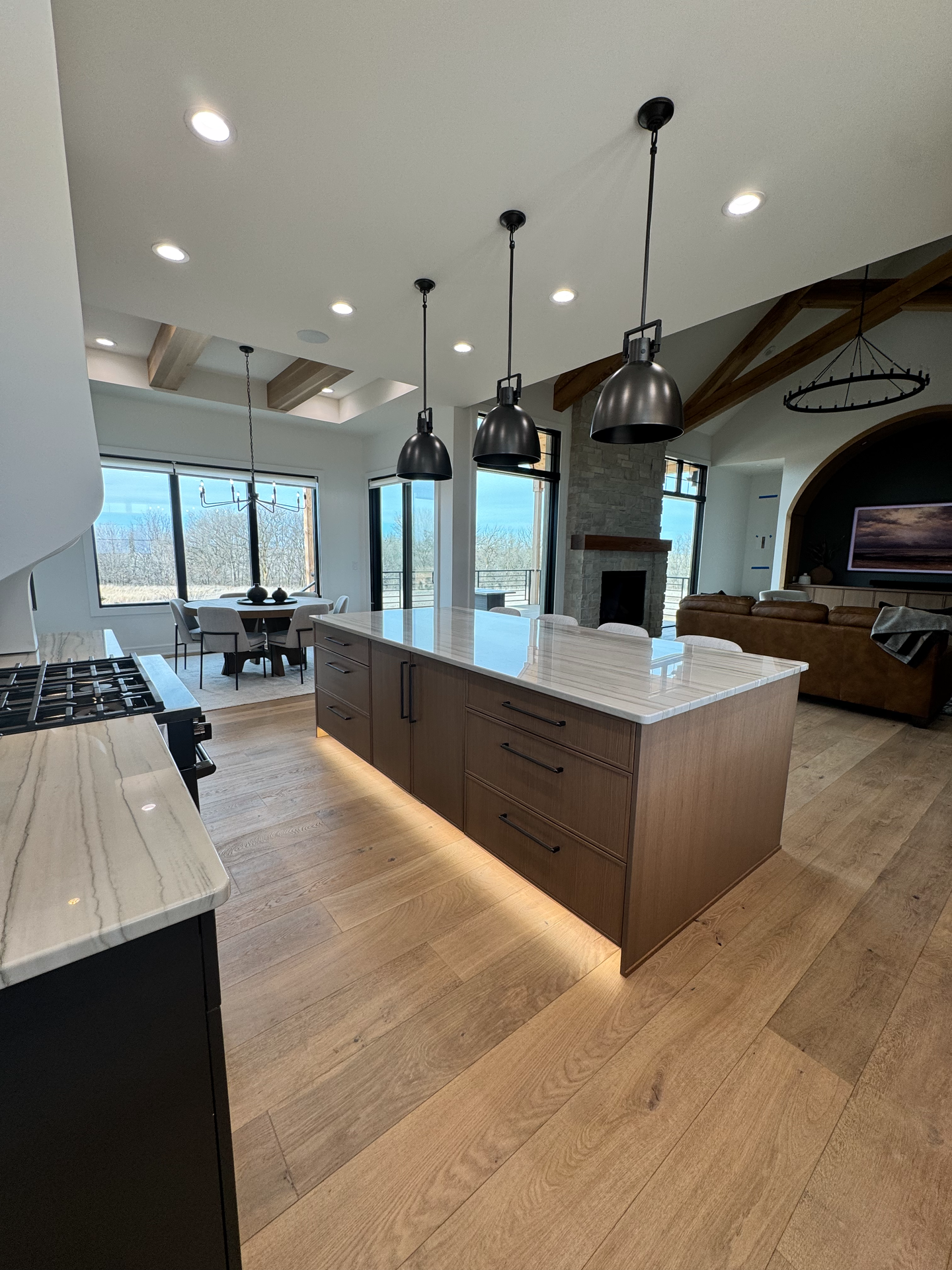 A kitchen with a large island in the middle of the room.