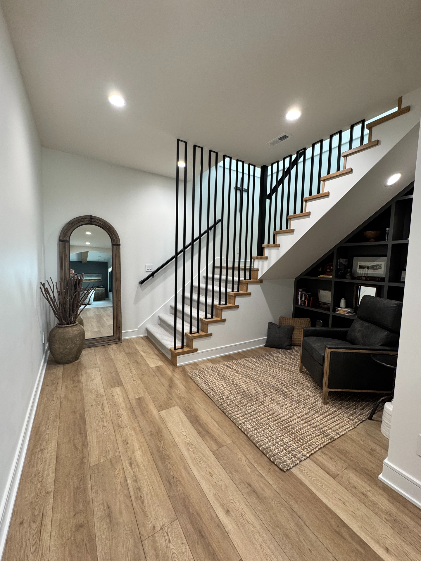 There is a staircase in the corner of the room.