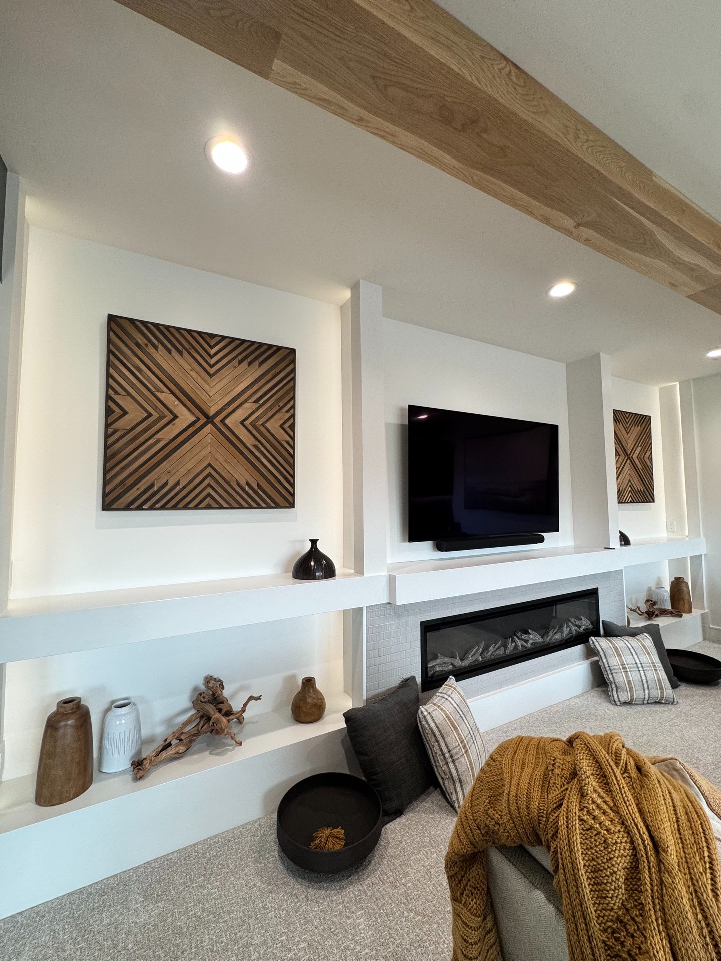 A living room with a fireplace and a flat screen tv.