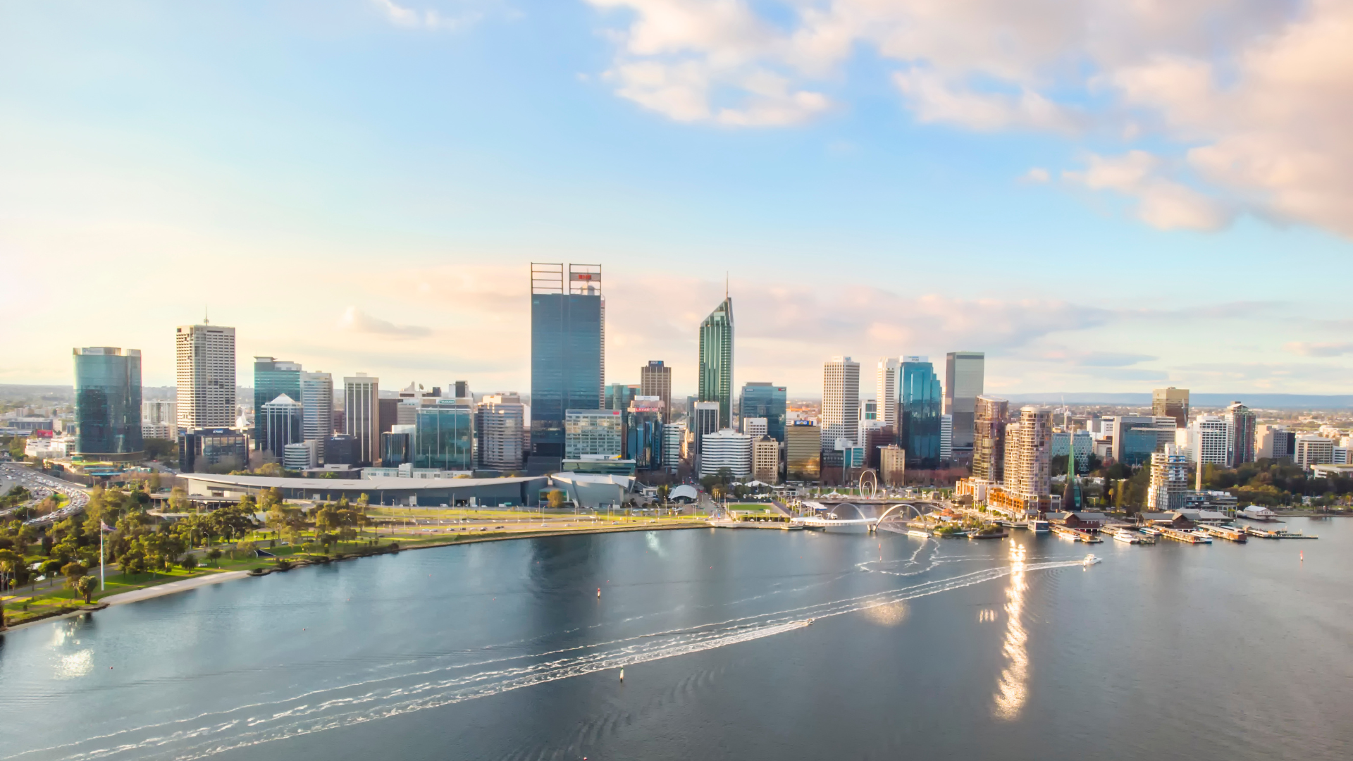 An aerial view of a city skyline overlooking a body of water.