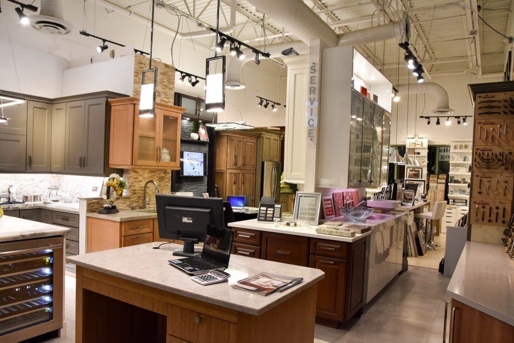 Interior of a home decor store with wooden counters, shelves, and hanging lights