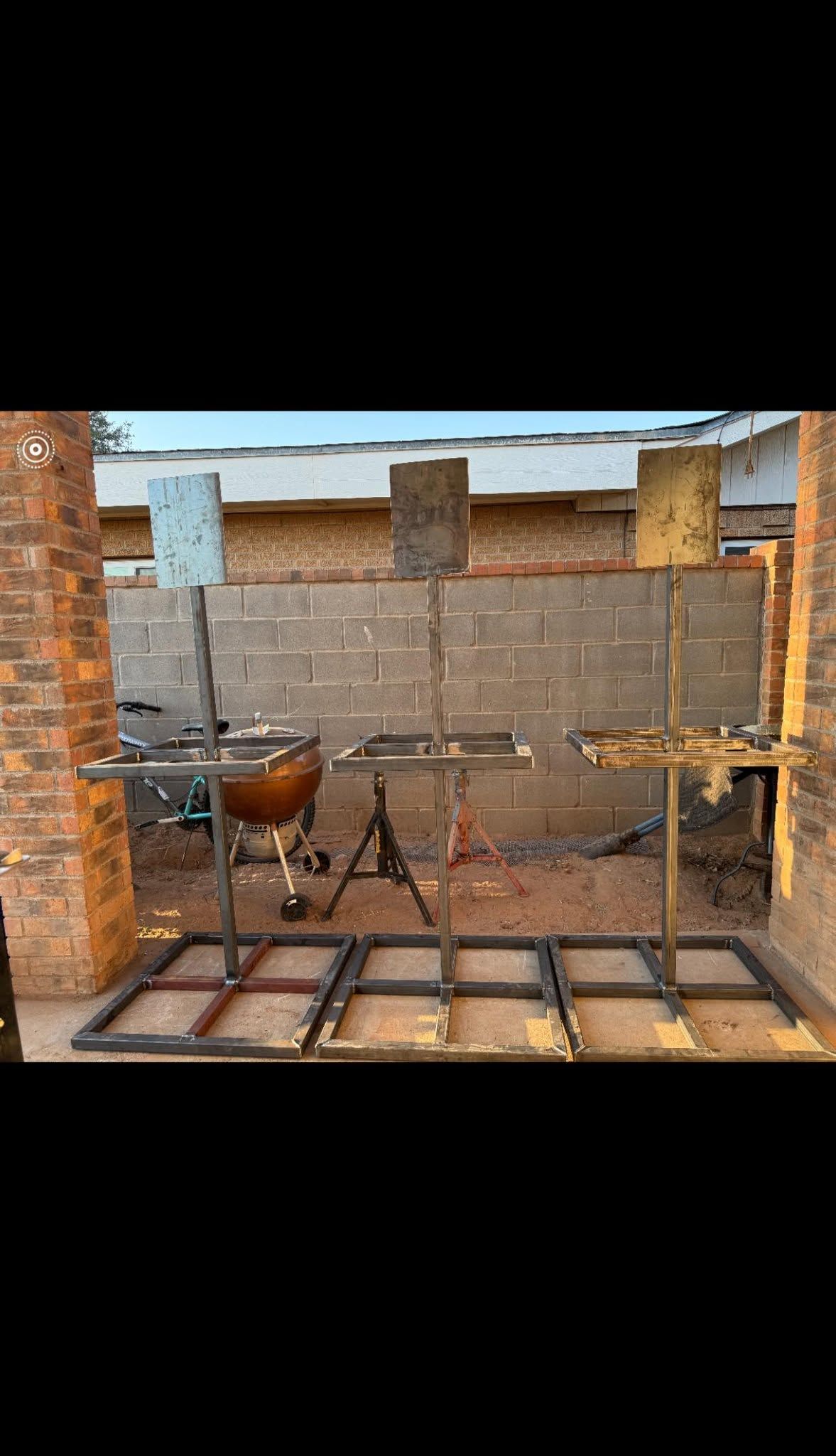 Rustic chicken coop with a metal cage, brick walls, and one hen inside.
