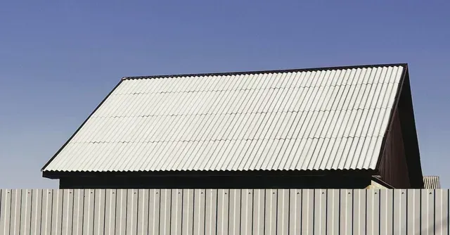 An image showcasing the installation process of a gutter guard system.