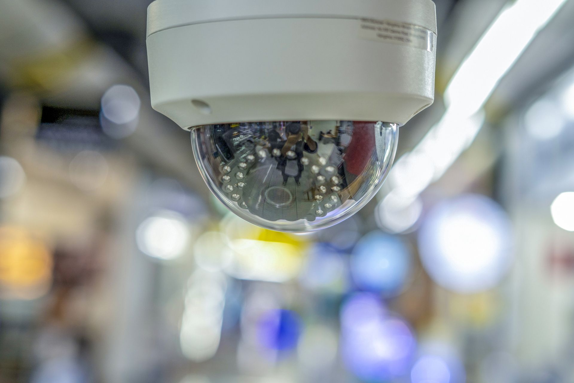Close-up of dome security camera installed indoors as part of modern CCTV camera systems. Close-up of dome security camera installed indoors as part of modern CCTV camera systems.