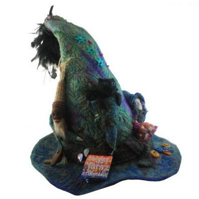 A witch hat with a book that says 