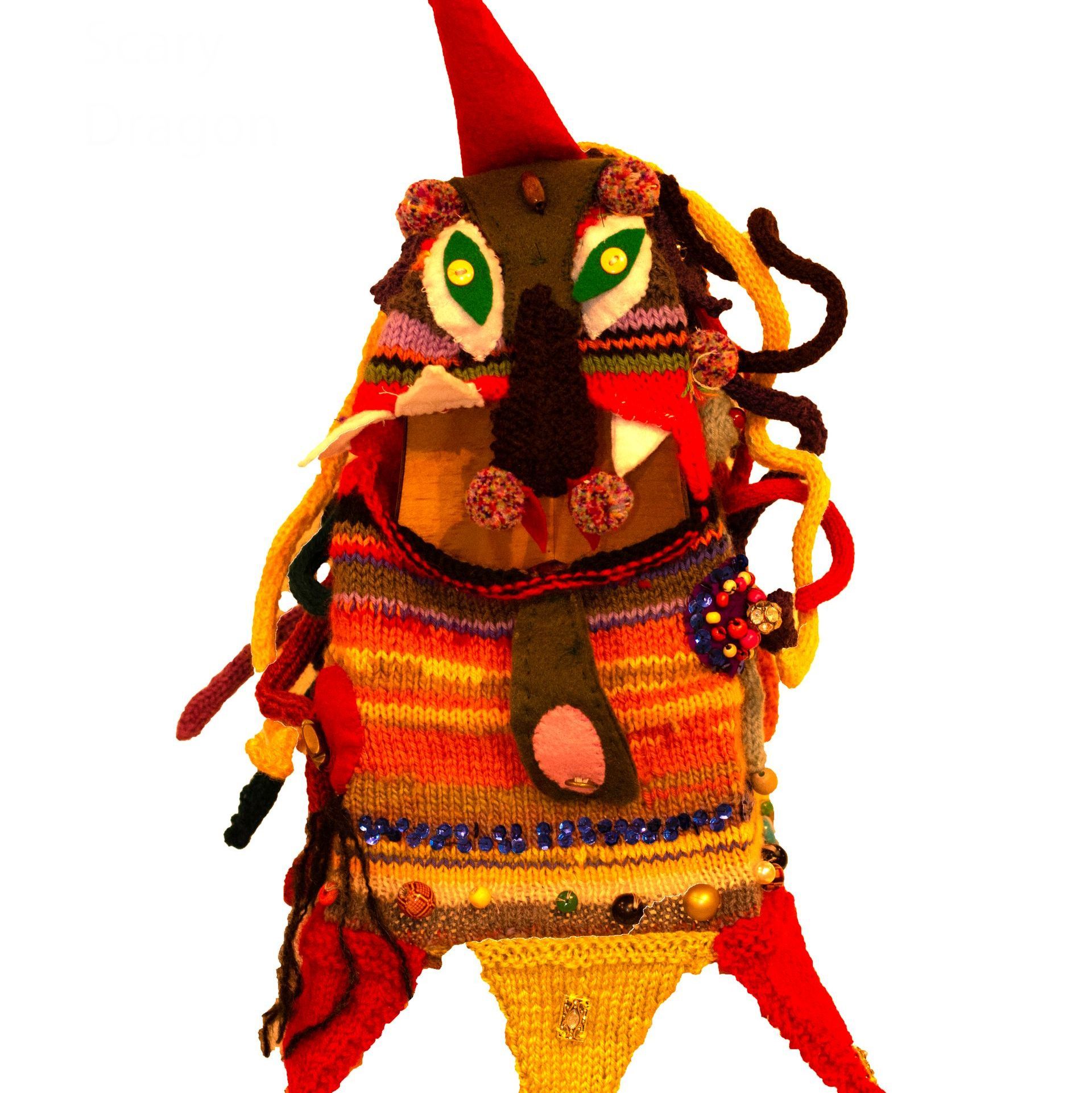 A stuffed animal with green eyes and a red hat