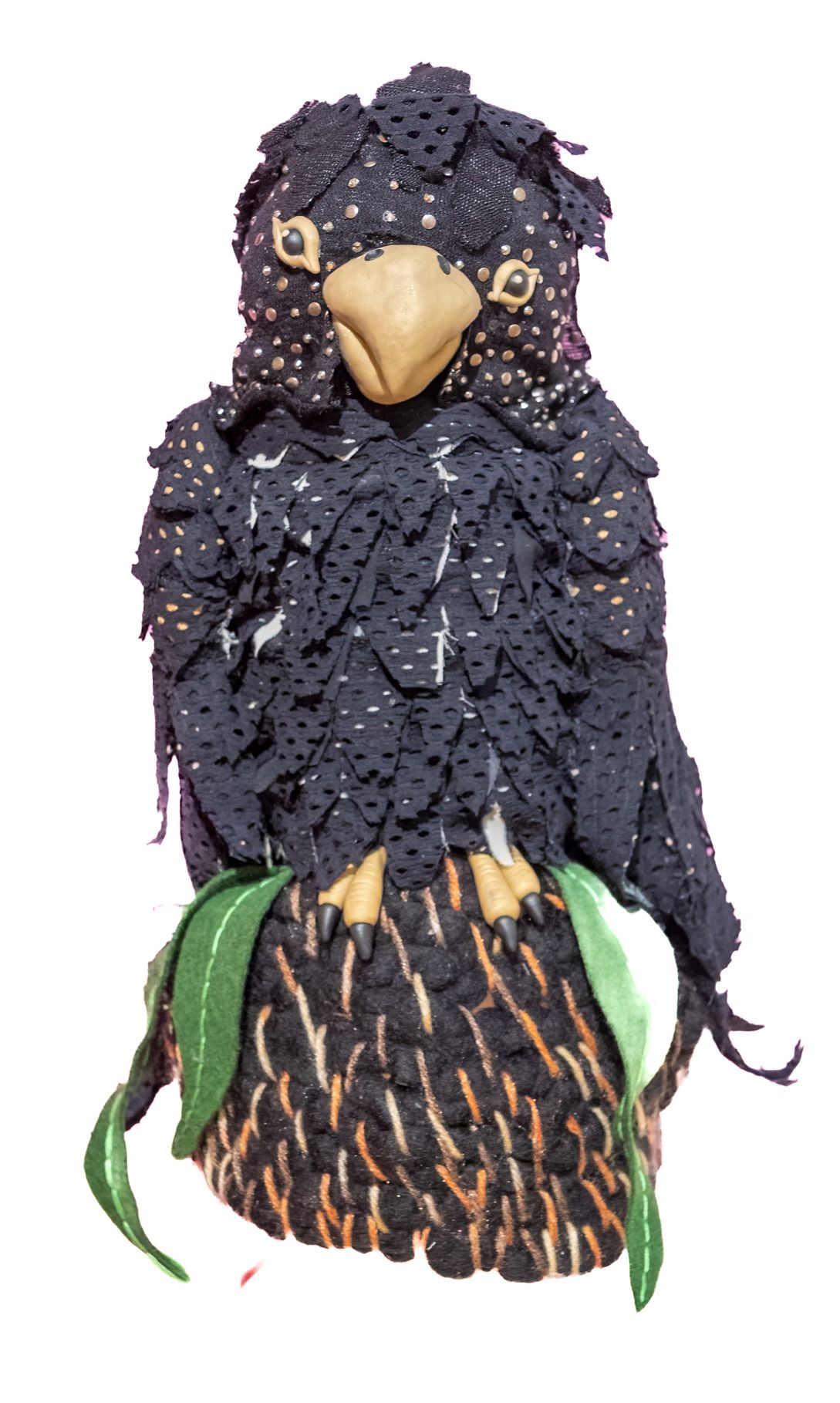 A statue of a black bird with a yellow beak