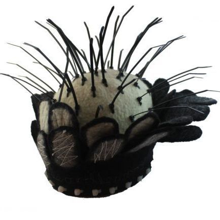 A black and white hat with feathers on it