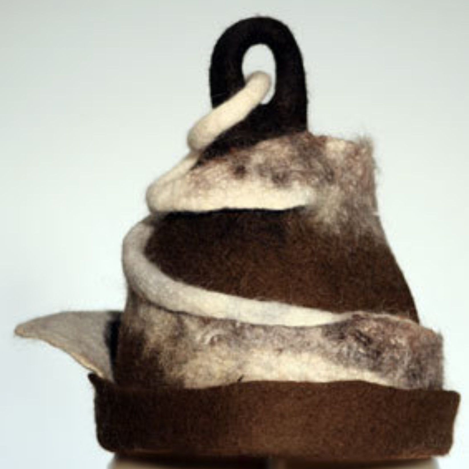 A brown and white hat with a rope around the top