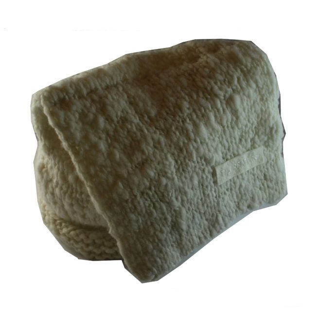 A white blanket is rolled up on a white background