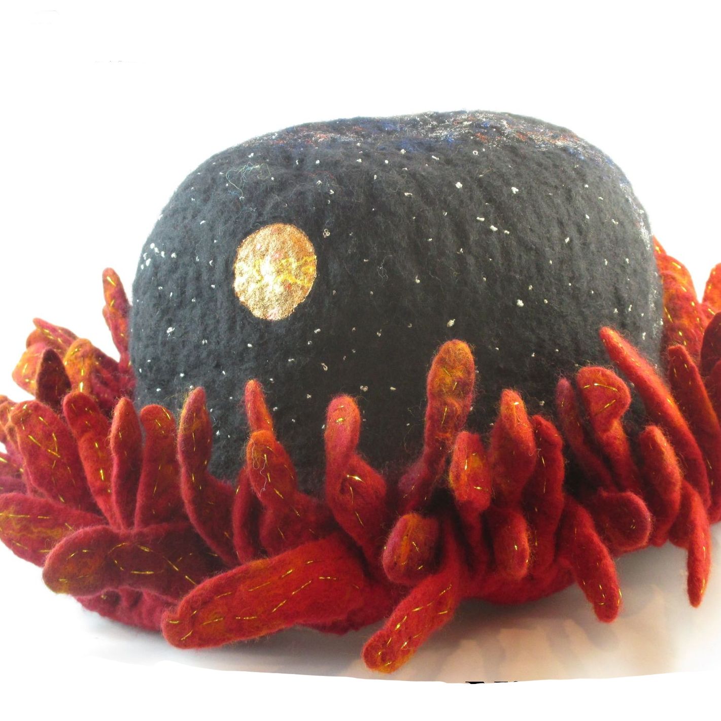 A black hat with a gold circle on top of it
