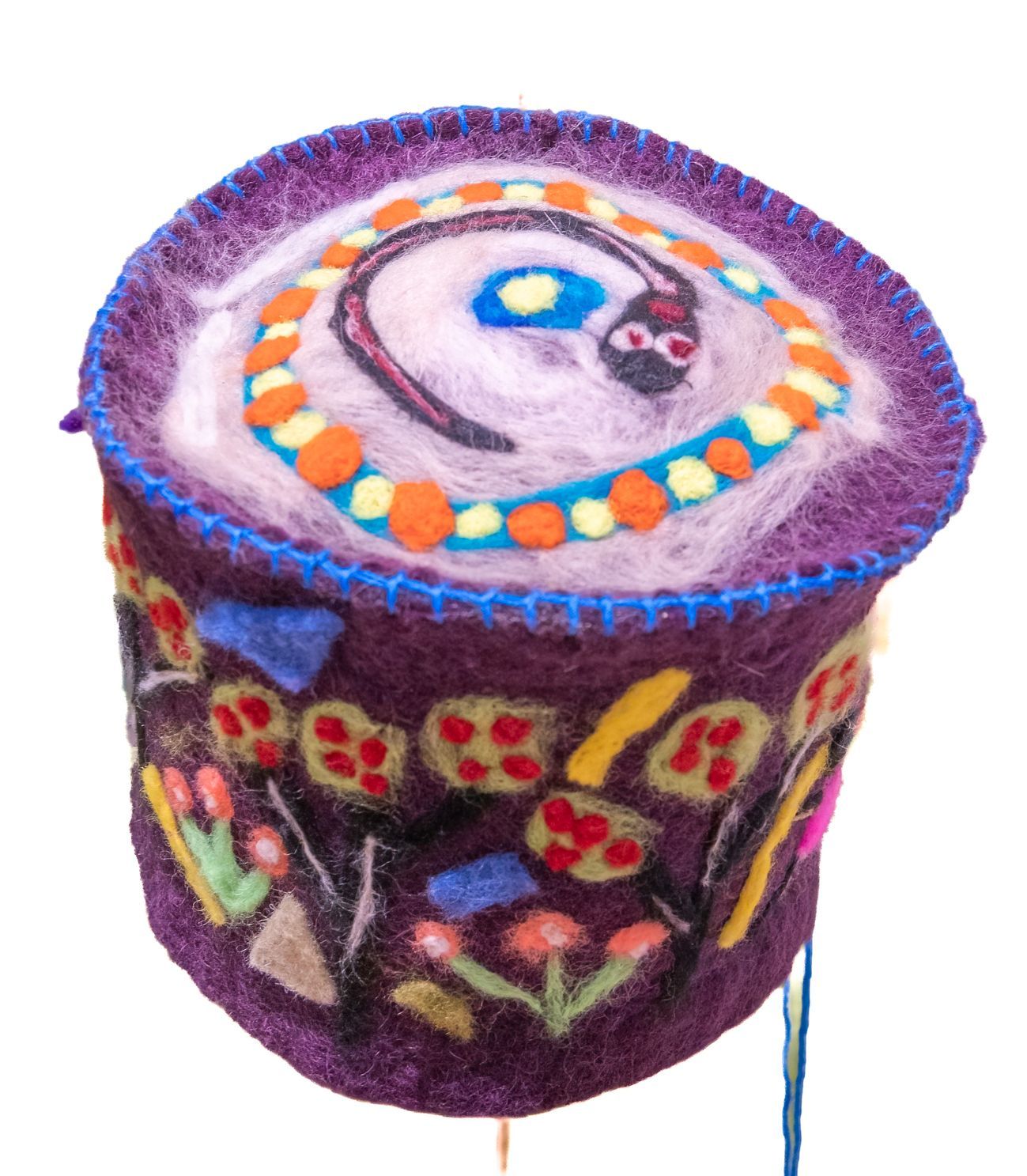 A purple item with flowers and a skull on it