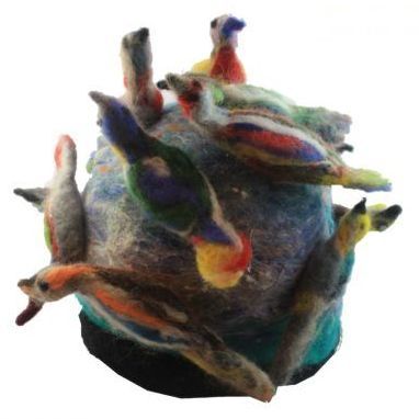 A bunch of birds are sitting on top of a ball