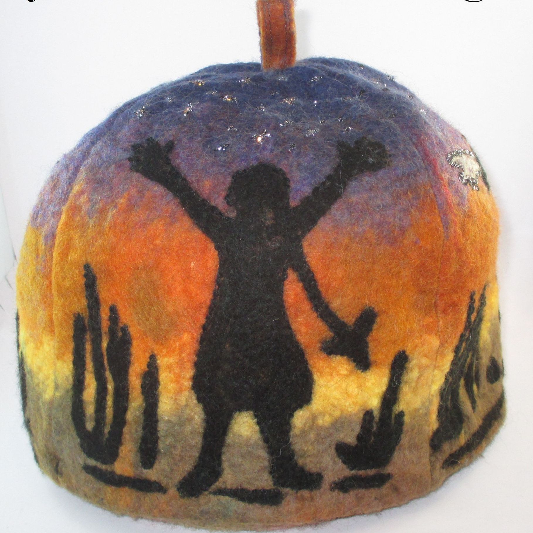 A pumpkin with a silhouette of a person on it