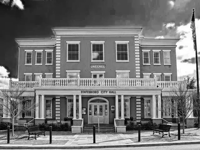 Statesboro City Hall, brick building with columns, in black and white.