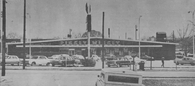 Exterior of Piggly Wiggly grocery store with parked cars in front.