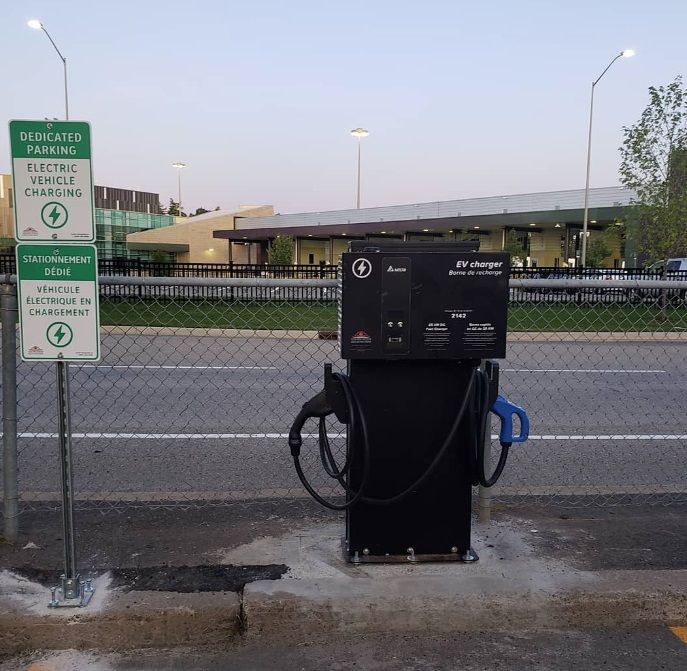 A gas pump with a sign that says dedicated parking
