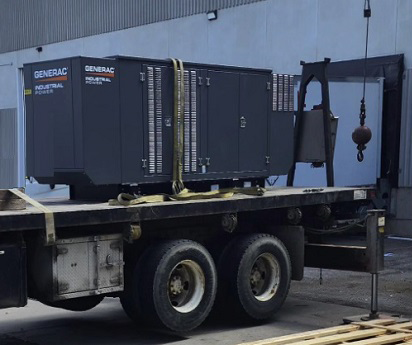 A generator is on the back of a truck