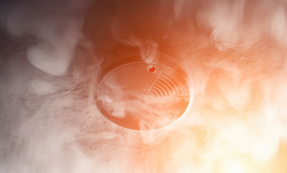 Close-up of a Circular Smoke Detector on a Ceiling — Instant Spark Electrical in Glen Isla, QLD