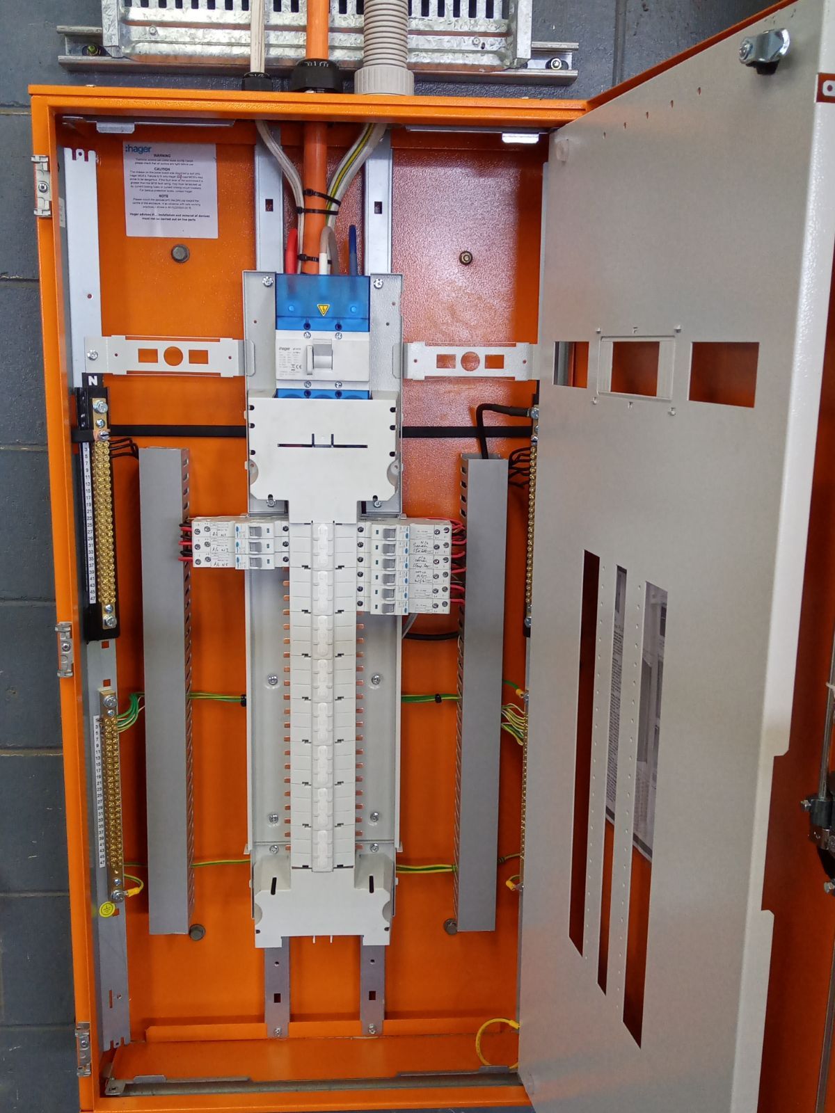 A Bunch of Wires Are Hanging on a Wall — Instant Spark Electrical in Glen Isla, QLD