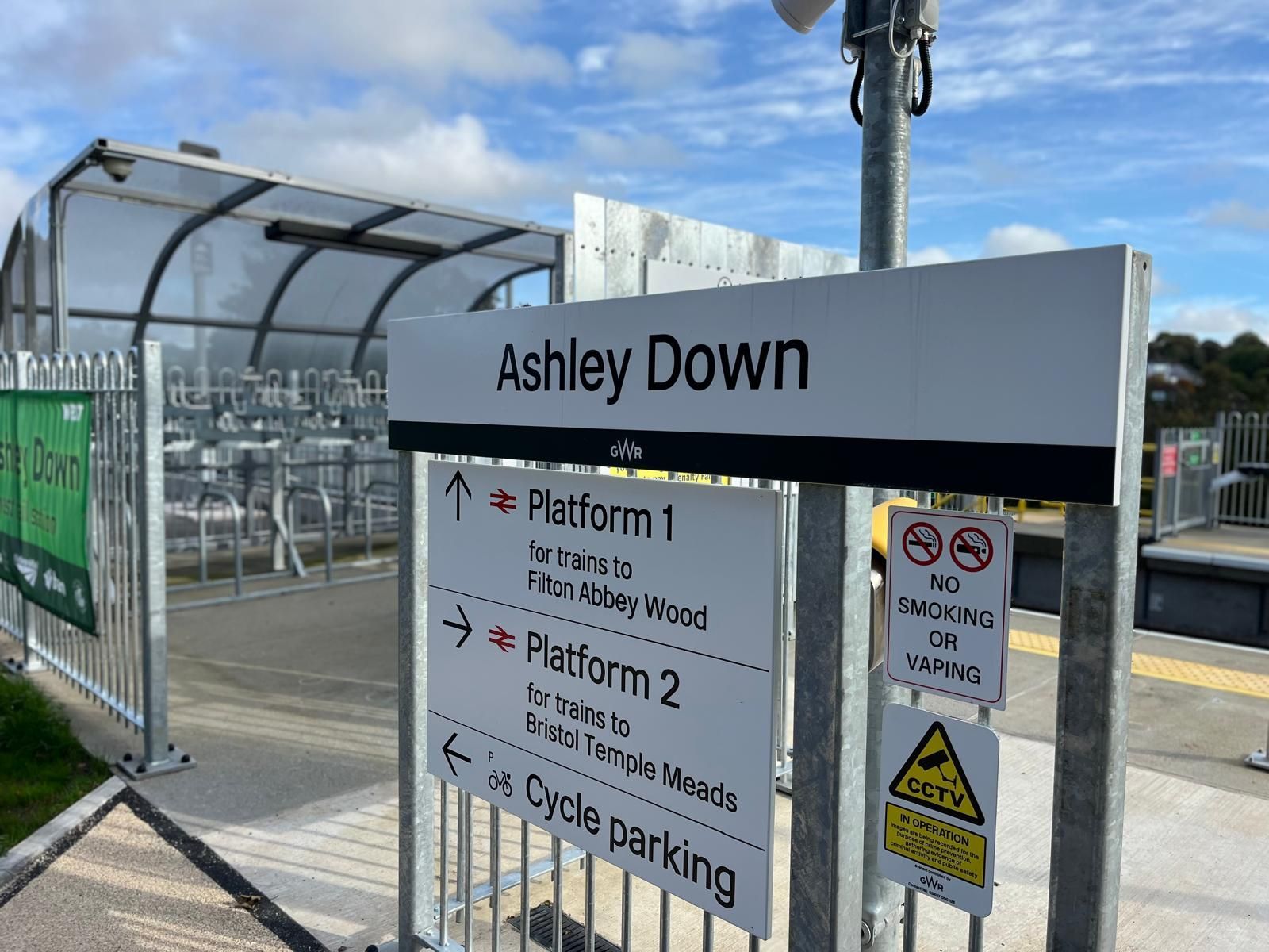Sign for Ashley Down train station, directing to platforms and cycle parking.