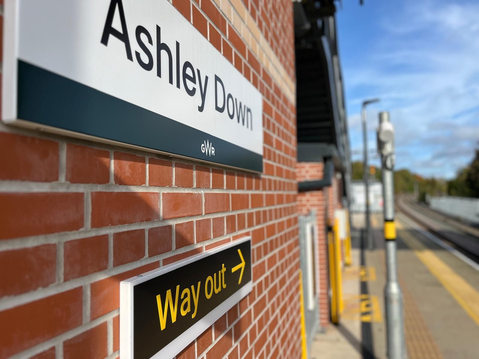 Sign for Ashley Down train station on brick wall; a 