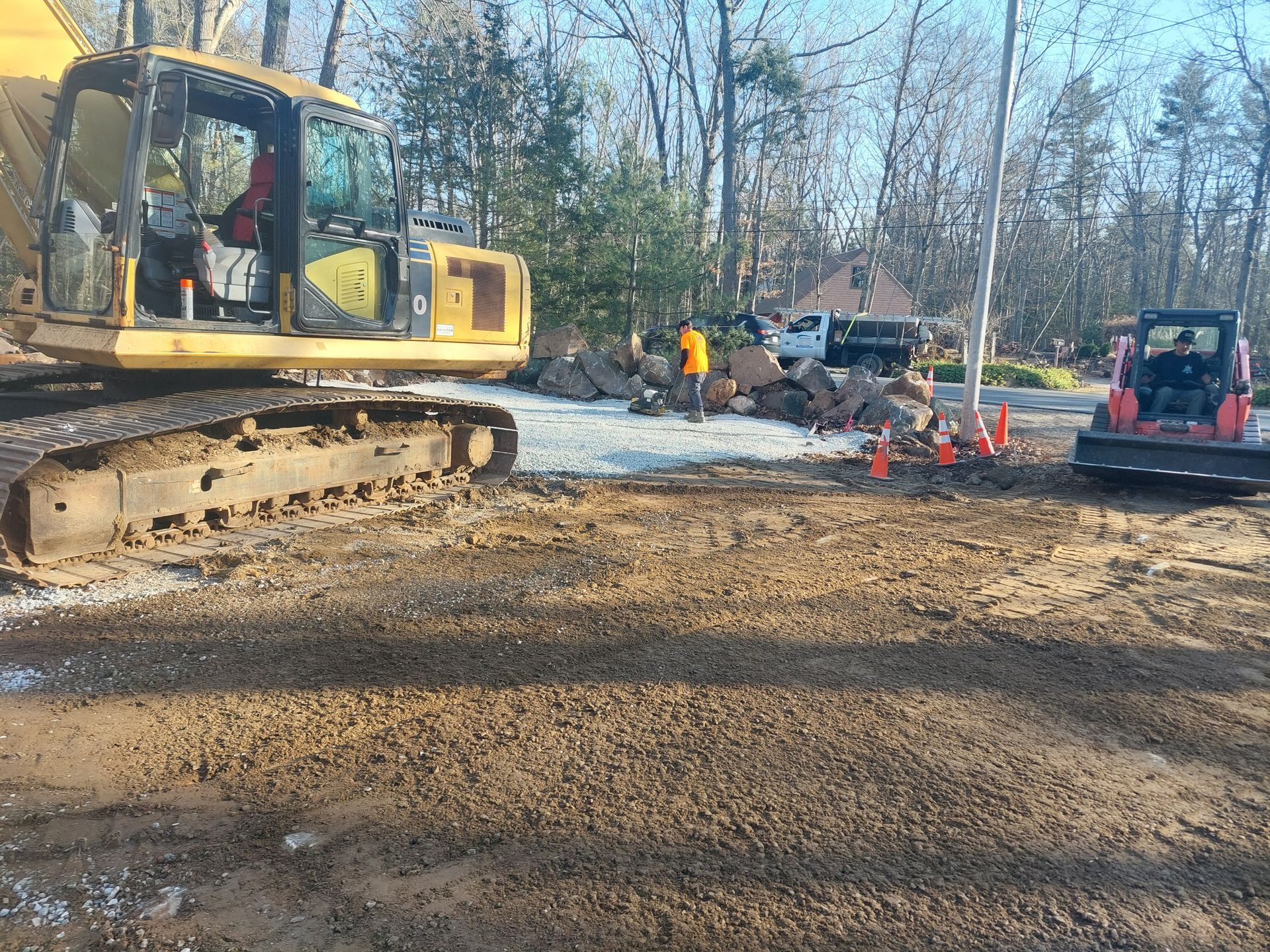 A large house with a porch and a lot of dirt in front of it
