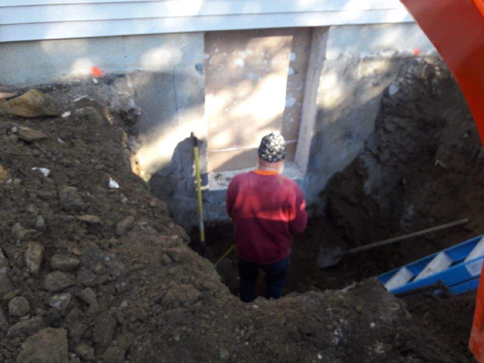 Worker Constructing Egress Window